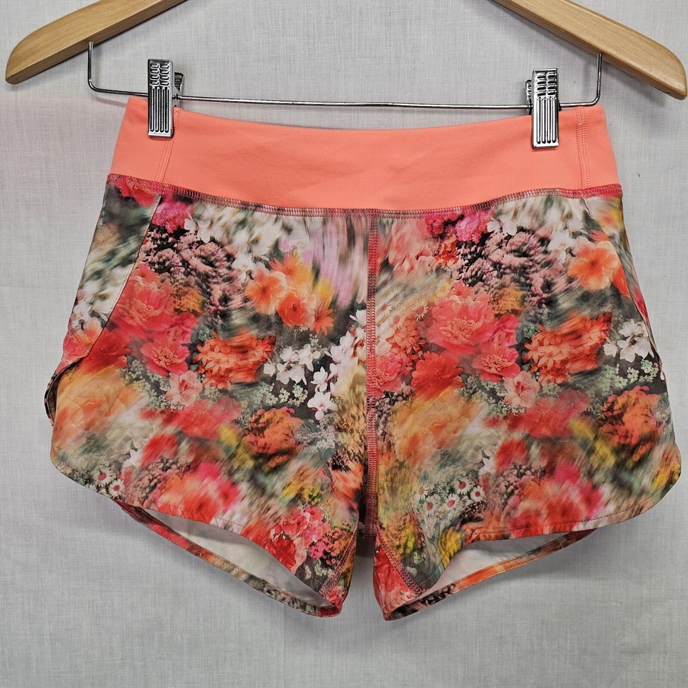 Athleta Girl Size L/12 Run the World 3" Shorts Orange Floral Print